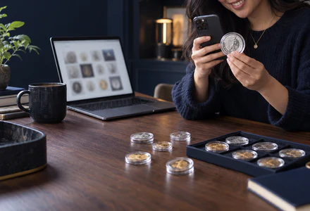 A collector photographing a British coin for her online collection